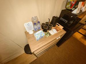 a small table in a room with a table with drinks at LasCalas Resort and Luxury Estate in Dasol