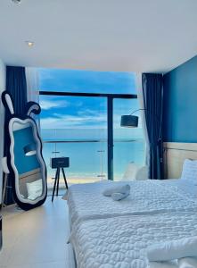 Postel nebo postele na pokoji v ubytování CSJ Tower Seaview Vũng Tàu - Căn Hộ CSJ Tầm Nhìn Biển và Tháp Tam Thắng Vũng Tàu