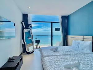 Postel nebo postele na pokoji v ubytování CSJ Tower Seaview Vũng Tàu - Căn Hộ CSJ Tầm Nhìn Biển và Tháp Tam Thắng Vũng Tàu