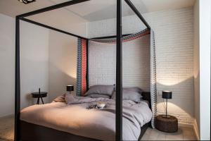 A bed or beds in a room at DestinationBCN Universitat Apartments