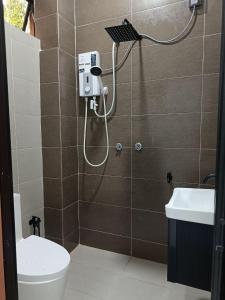 Koupelna v ubytování ZZD Gunong Roomstay + 17 fotografií