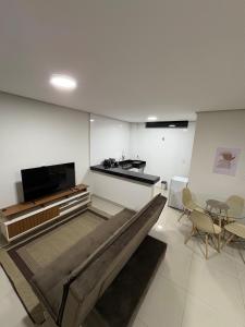 TV a/nebo společenská místnost v ubytování flat ao lado do shopping