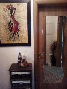 a room with a door and a dresser and a mirror at Apartment Ksenija in Crikvenica