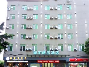 a facade of a hotel with air conditioners at City Comfort Inn Qingyuan Longtang Light Rail Changlong in Qingyuan
