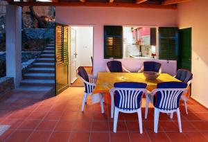 a dining room with a table and chairs at Villa Sol in Vinišće