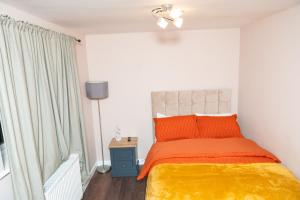 Ένα ή περισσότερα κρεβάτια σε δωμάτιο στο Absolute Tranquillity Home