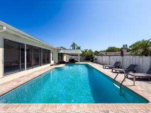 a swimming pool in the backyard of a house at 2631 Cedarglen Drive in Dunedin
