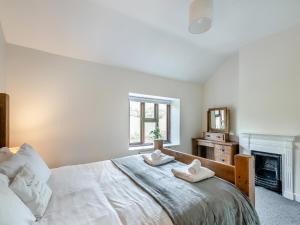 En eller flere senge i et værelse på Vera's Cottage