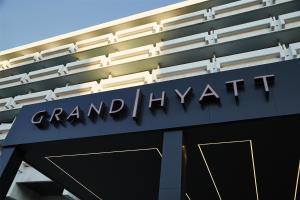 a grand hyatt sign on the side of a building at Grand Hyatt Athens in Athens