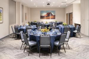 a conference room with blue tables and chairs at Hyatt Place East Moline/Quad Cities in East Moline +28 photos
