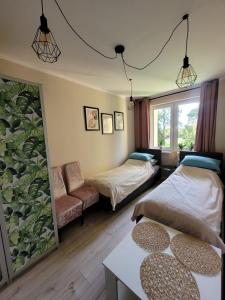 Postel nebo postele na pokoji v ubytování Apartament MILANO Chojnice
