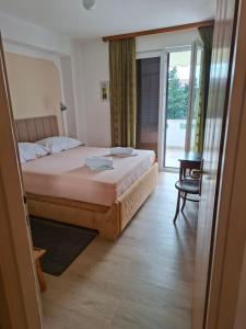 Ένα ή περισσότερα κρεβάτια σε δωμάτιο στο Apartmani Vidaska