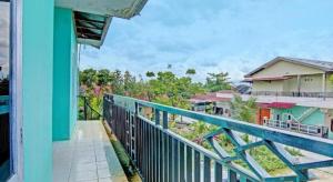 a view from a balcony of a house at SPOT ON 91918 Najla Guest House Syariah in Pekanbaru