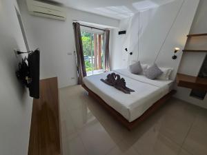 En eller flere senge i et værelse på Replay Comfortable Apartment + 30 billeder