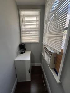a small room with a heater and a window at Roslyn Village Motel RM2 in Roslyn