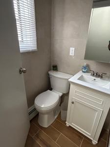 a bathroom with a white toilet and a sink at Roslyn Village Motel RM2 in Roslyn