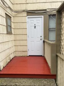 a white door with a red mat in front of a building at Roslyn Village Motel RM2 in Roslyn