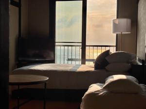 Giường trong phòng chung tại Alim STAY IZU アリムステイ 伊豆