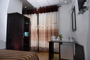 Ένα ή περισσότερα κρεβάτια σε δωμάτιο στο L&D Lodge