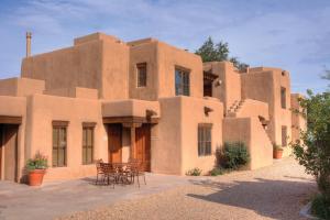 a building with tables and chairs in front of it at WorldMark Santa Fe in Santa Fe