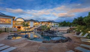 a house with a swimming pool in the yard at Club Wyndham Bali Hai Villas in Princeville
