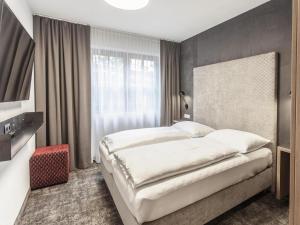 a bedroom with a large bed and a window at Apartment in Sölden near Giggijochbahn in Sölden