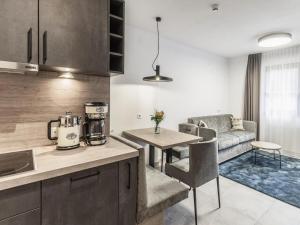 a kitchen and living room with a couch and a table at Apartment in Sölden near Giggijochbahn in Sölden