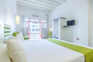 Postel nebo postele na pokoji v ubytování Itsy Hotels Red Lotus Heritage, Promenade Beach