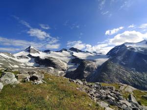 a view of a mountain range with snow covered mountains at Chalet in Neukirchen by Wildkogel Ski Slopes in Neukirchen am Großvenediger