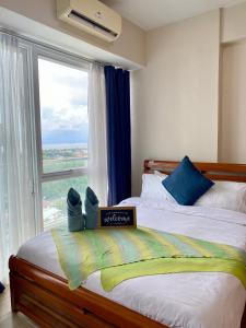 Ένα ή περισσότερα κρεβάτια σε δωμάτιο στο Spacious 2bedroom with Seaview