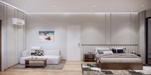a bedroom with a bed and a couch at Private Villa by YUSETH Residence in Phumi Ta Phul