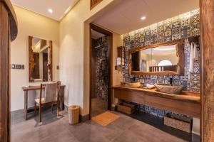 a bathroom with a sink and a mirror at Sun Village in Tuy Hoa +65 photos
