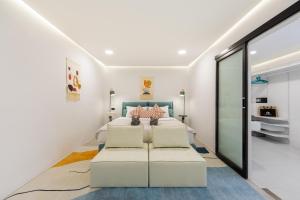 a bedroom with a bed and a couch at Pool Access Spacious Townhouse and Kids Slide in Koh Samui +60 photos