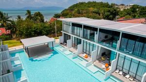 an aerial view of a house with a swimming pool at Pool Access Spacious Townhouse and Kids Slide in Koh Samui