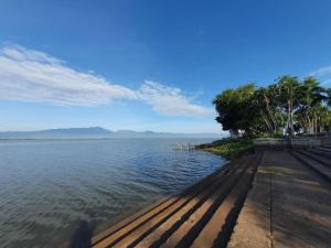 a view of a body of water with trees at Kwan Phayao Villa in Phayao