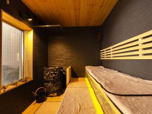 Postel nebo postele na pokoji v ubytování 湯宿くったり温泉 レイクイン