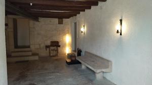 a room with a bench on a wall with a piano at Casa Remunda in Torregrosa