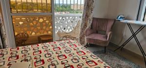 Ένα ή περισσότερα κρεβάτια σε δωμάτιο στο Nyali Fully Furnished Apartment