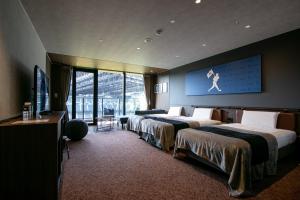 Postel nebo postele na pokoji v ubytování tower eleven hotel + 17 fotografií