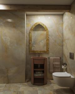 Un baño con lavabo, inodoro y espejo. en Hotel Riva, en Venecia