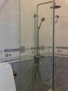 a shower with a glass door in a bathroom at SONA Hotel - Muine, Phan Thiet, Summerland in Ấp Chợ Dinh