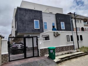 a white house with a black gate and a fence at Evarest Metrostay Global in Iranla