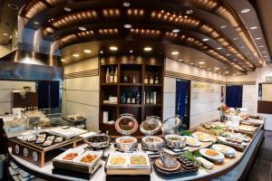 a buffet line in a restaurant with many plates of food at Toretore Village Nanki Shirahama in Shirahama