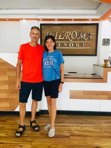 a man and a woman standing in a room at Wilroma Hotel&Resort in Anuradhapura
