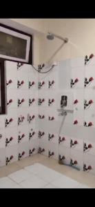 a room with a bunch of birds on the wall at Nature Retreat in Gangtok