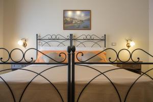 Posteľ alebo postele v izbe v ubytovaní B&B Palazzo Tornabene