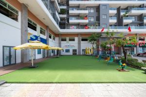 a playground in the middle of a building at Monarchy Riverside Da Nang - Modern Stay & Pool in Da Nang