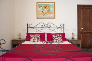 Posteľ alebo postele v izbe v ubytovaní B&B Palazzo Tornabene
