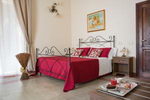 Posteľ alebo postele v izbe v ubytovaní B&B Palazzo Tornabene