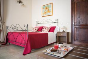 Posteľ alebo postele v izbe v ubytovaní B&B Palazzo Tornabene